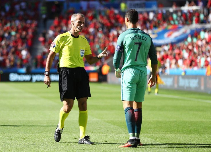 Cristiano Ronaldo talks to the referee