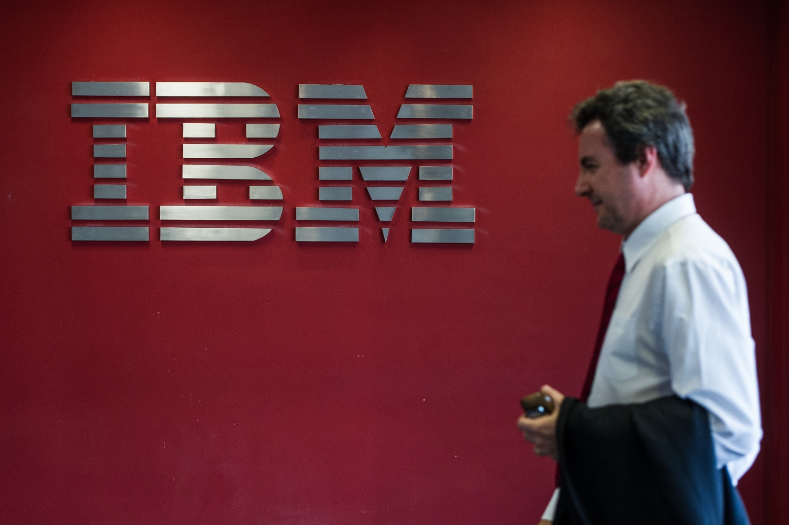 IBM logo and staffer IBM logo and staffer
