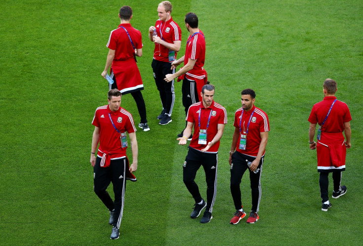 Welsh players walk around the pitch