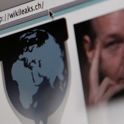 A screen shot of a web browser displaying the WikiLeaks website with a picture of its founder Julian Assange in Bern