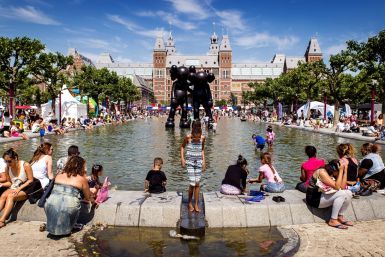 People in Amsterdam cool off in fountain