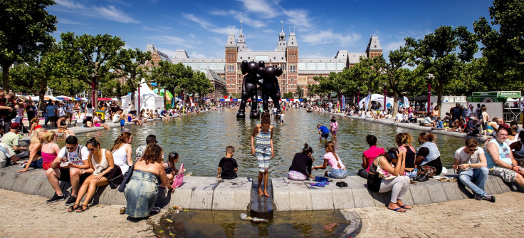 People in Amsterdam cool off in fountain