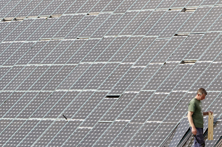 A man works on solar panels