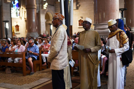 Muslims of the Comorian community attend a Mass at the Sacre Coeur basilica in Marseille in tribute to the priest Jacques Hamel, killed on July 26