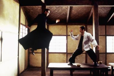 Actor Keanu Reeves (L) and Collin Chou are shown in a scene from the new futuristic action thriller film&quot;The Matrix Reloaded,&quot; also starring Laurence Fishburne and Carrie-Anne Moss in this undated publicity photograph.