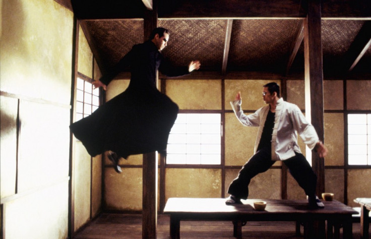 Actor Keanu Reeves (L) and Collin Chou are shown in a scene from the new futuristic action thriller film&quot;The Matrix Reloaded,&quot; also starring Laurence Fishburne and Carrie-Anne Moss in this undated publicity photograph.
