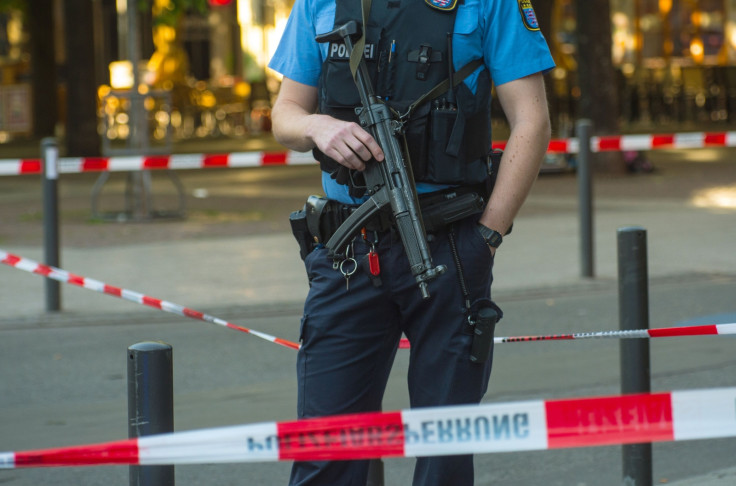 File Photo:An armed policeman is seen behind a barrier tape at the site of a shooting in the centre of Frankfurt am Main