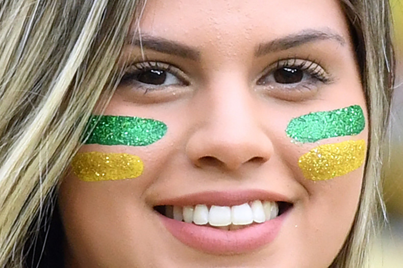 A Brazil fan watches the game