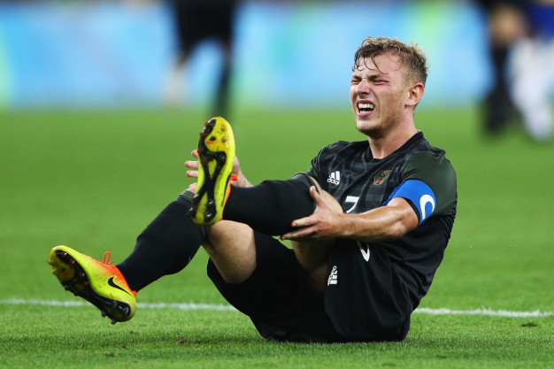 Max Meyer goes down with cramp Max Meyer goes down with cramp