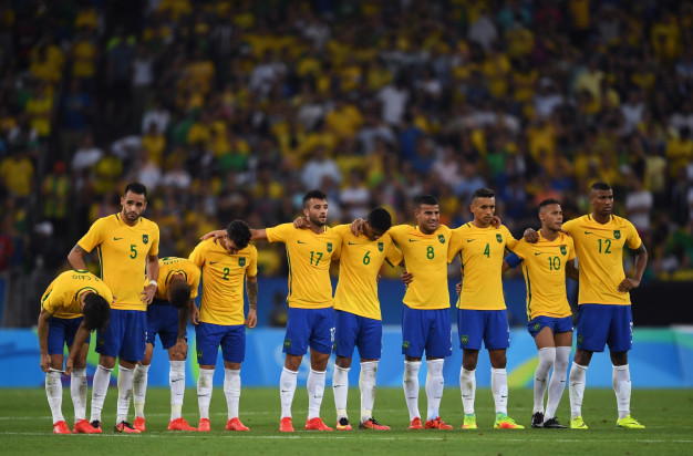 Brazil's players watch on Brazil's players watch on
