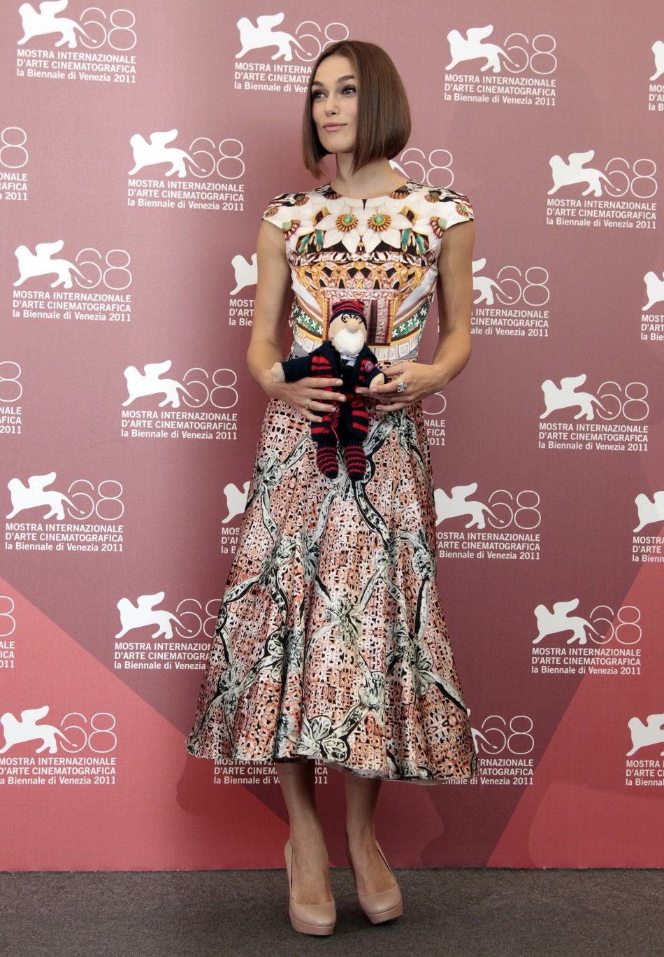 Actress Keira Knightley holds a cuddly toy given to her by co-star Viggo Mortensen at a photocall for their film quotA Dangerous Methodquot which is in competition at the 68th Venice Film Festival