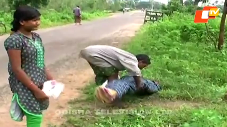 Image result for orissa man carries his dead wife on his shoulder