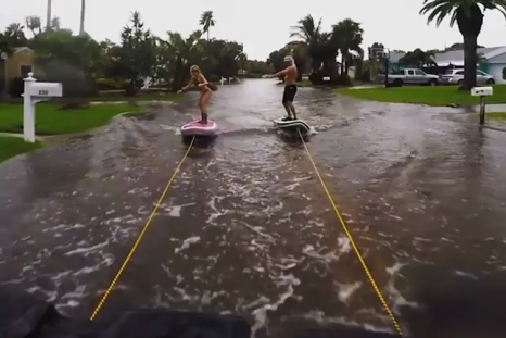 Paddle boarders make the most of Hurrican Hermine's floodwater
