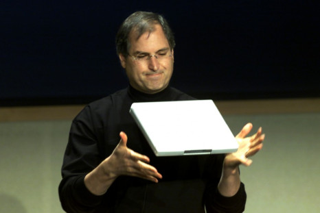 APPLE CEO STEVE JOBS DEMONSTRATES NEW NOTEBOOK COMPUTER.