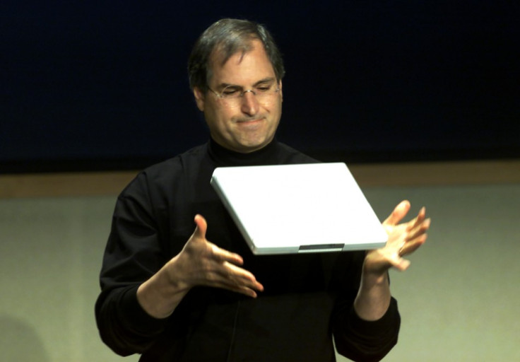 APPLE CEO STEVE JOBS DEMONSTRATES NEW NOTEBOOK COMPUTER.