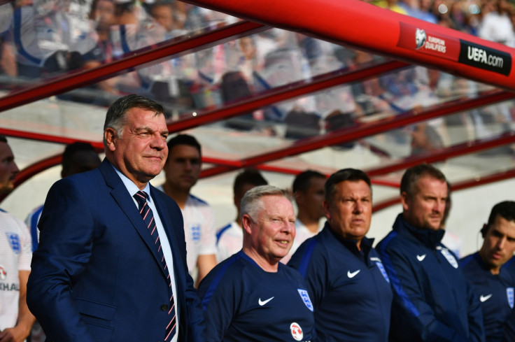 England's coaching staff watch on