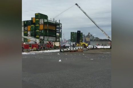 Seattle firefighters battle to stop chemical leak from barge fire