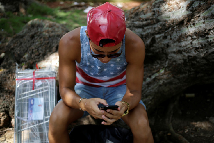 A man uses the internet via public Wi-Fi in Havana, Cuba