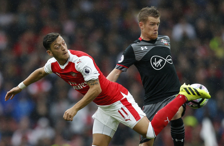 Mesut Ozil flicks the ball