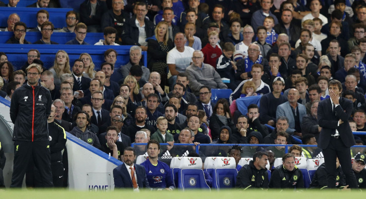 The managers watch the goal