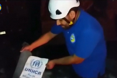 Syrian Civil Defense at destroyed UN aid