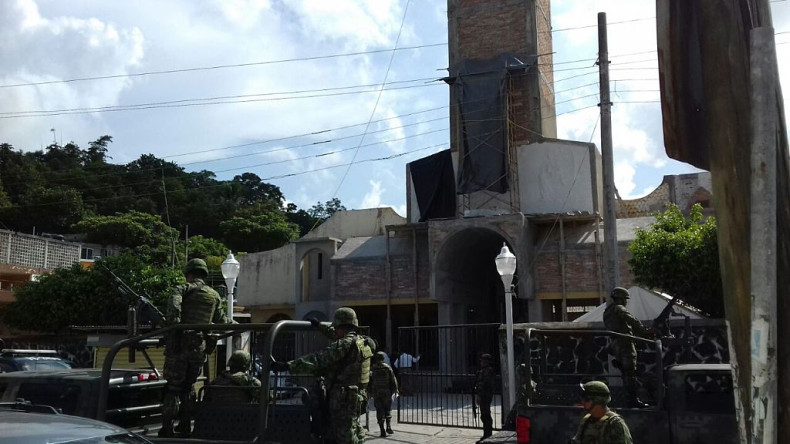 Mexican soldiers arrive at the Nuestra Senora de Fatima church after the catholics priests Alejo Nabor Jimenez Juarez and Jose Alfredo Juarez de la Cruz were kidnapped by gunmen