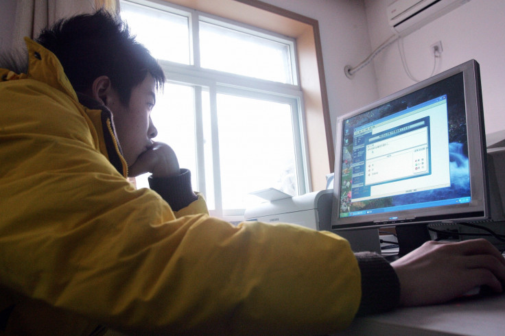 A boy uses a computer in China