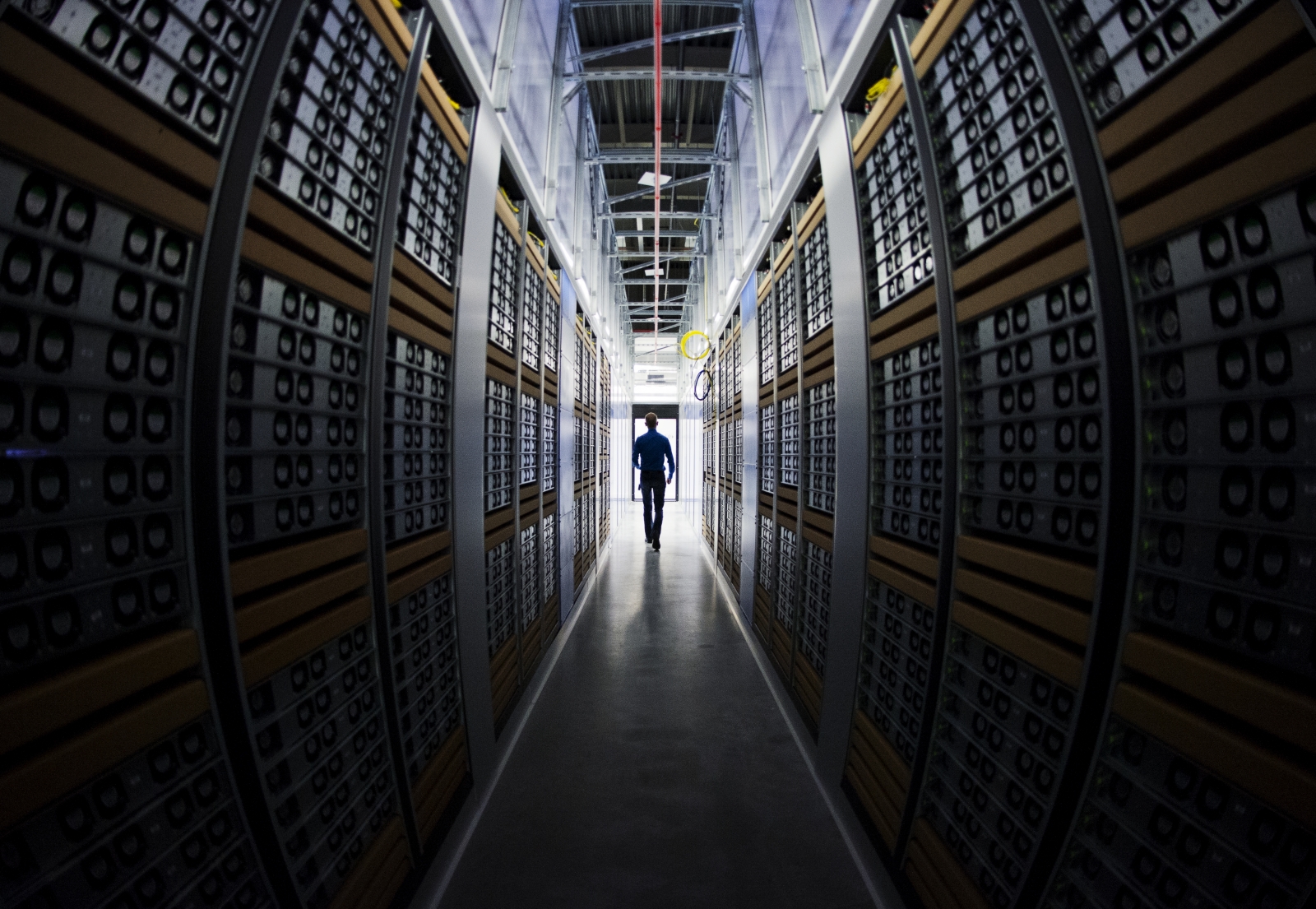 A long corridor stacked with server racks.