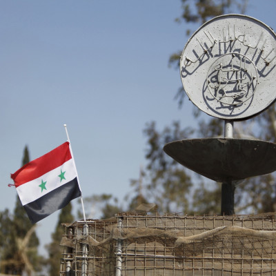 Syria flag near Isis slogan