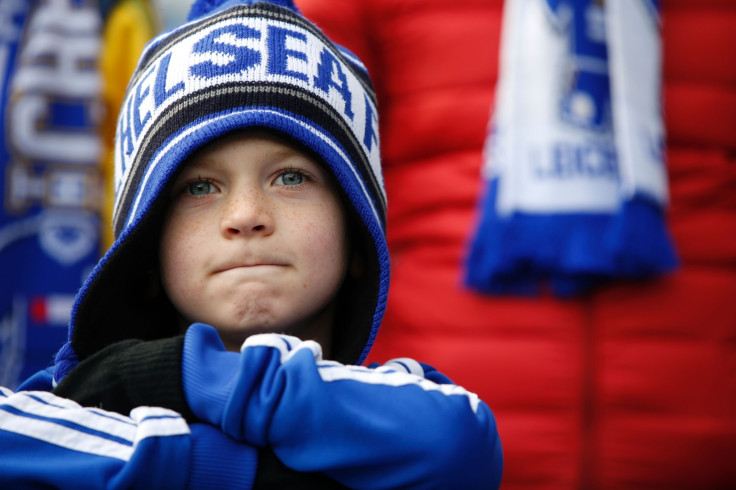 A young Chelsea fan watches on