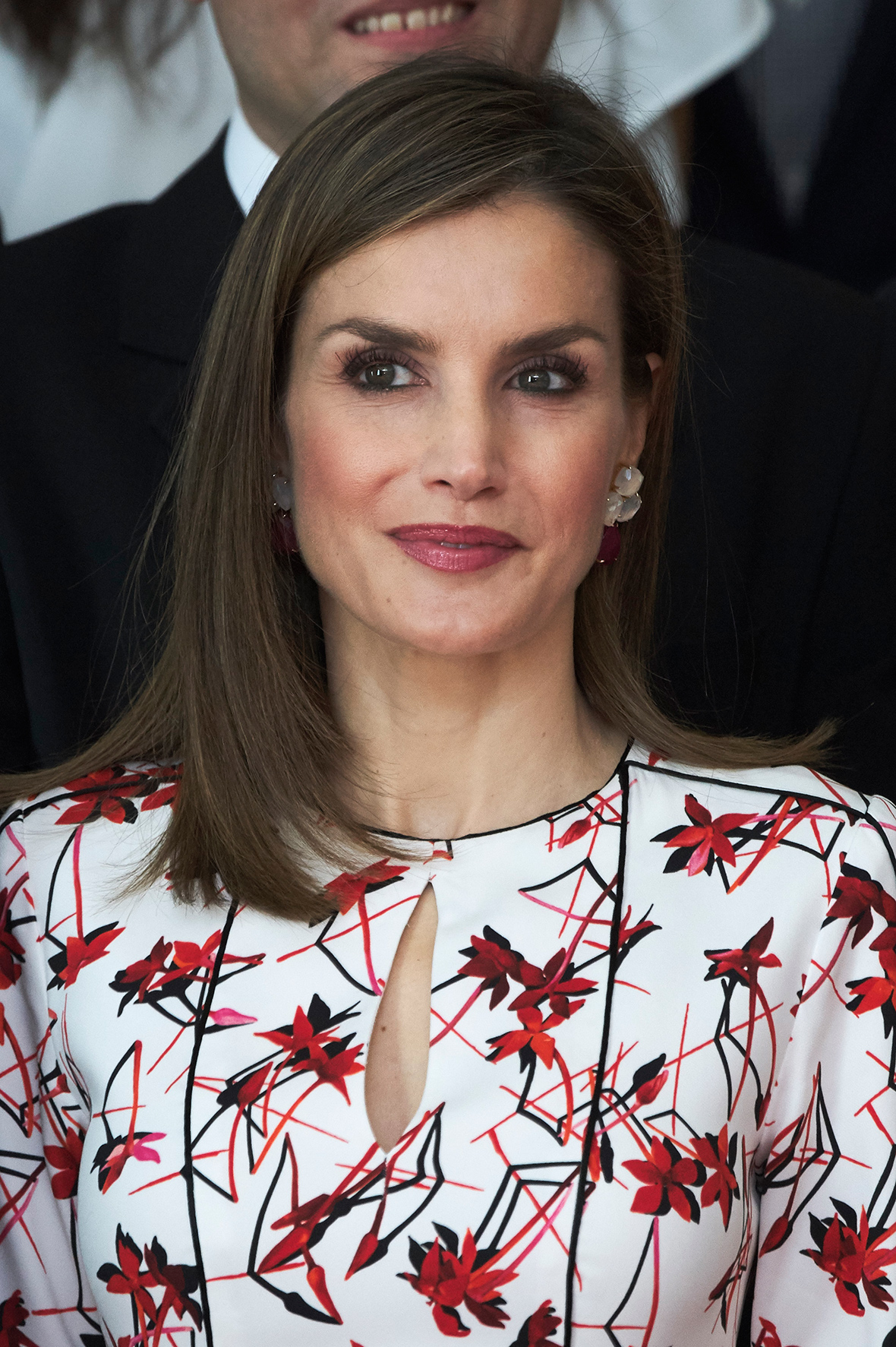 Queen of versatile! Letizia of Spain goes classic in red floral dress day after donning 90s LBD
