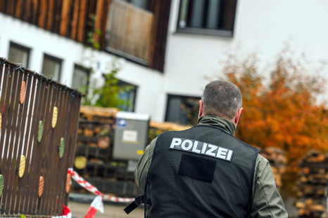 policeman is pictured on October 19, 2016 in Georgensgmuend, southern Germany, in front of a house of a member of the so-called Reichsbuerger movement.
