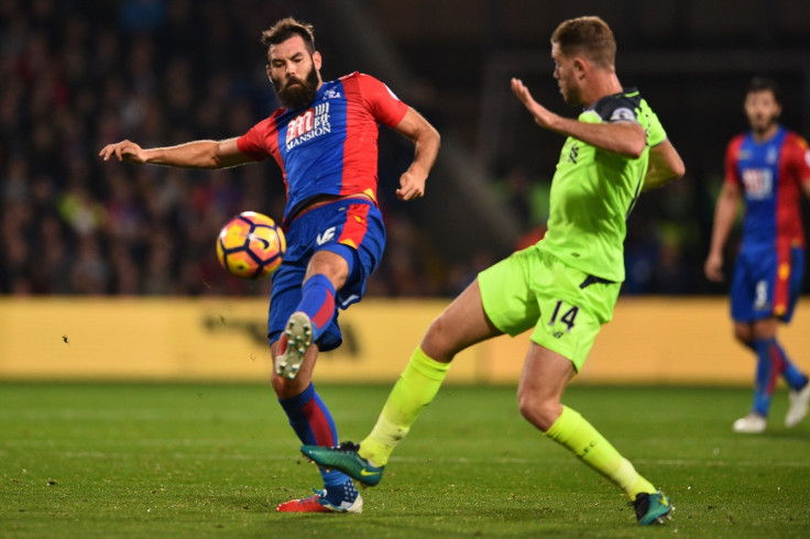 Joe Ledley challenges for the ball