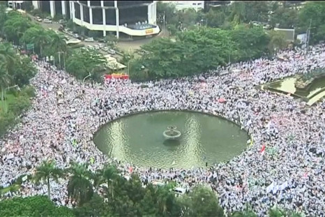 Tens of thousands march in Indonesia against city governor