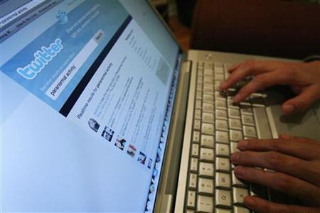 A Twitter page is displayed on a laptop computer in Los Angeles
