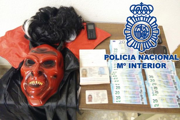Hamid Hakkar arrested by police wearing a Devil costume. Hamid Hakkar arrested by police wearing a Devil costume.