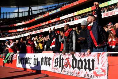 Arsenal fans cheer their side on