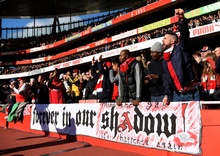 Arsenal fans cheer their side on