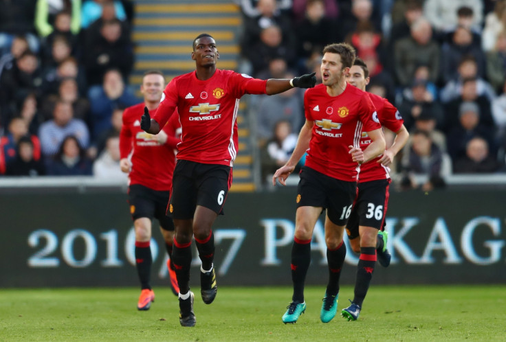 Paul Pogba (left) and Michael Carrick