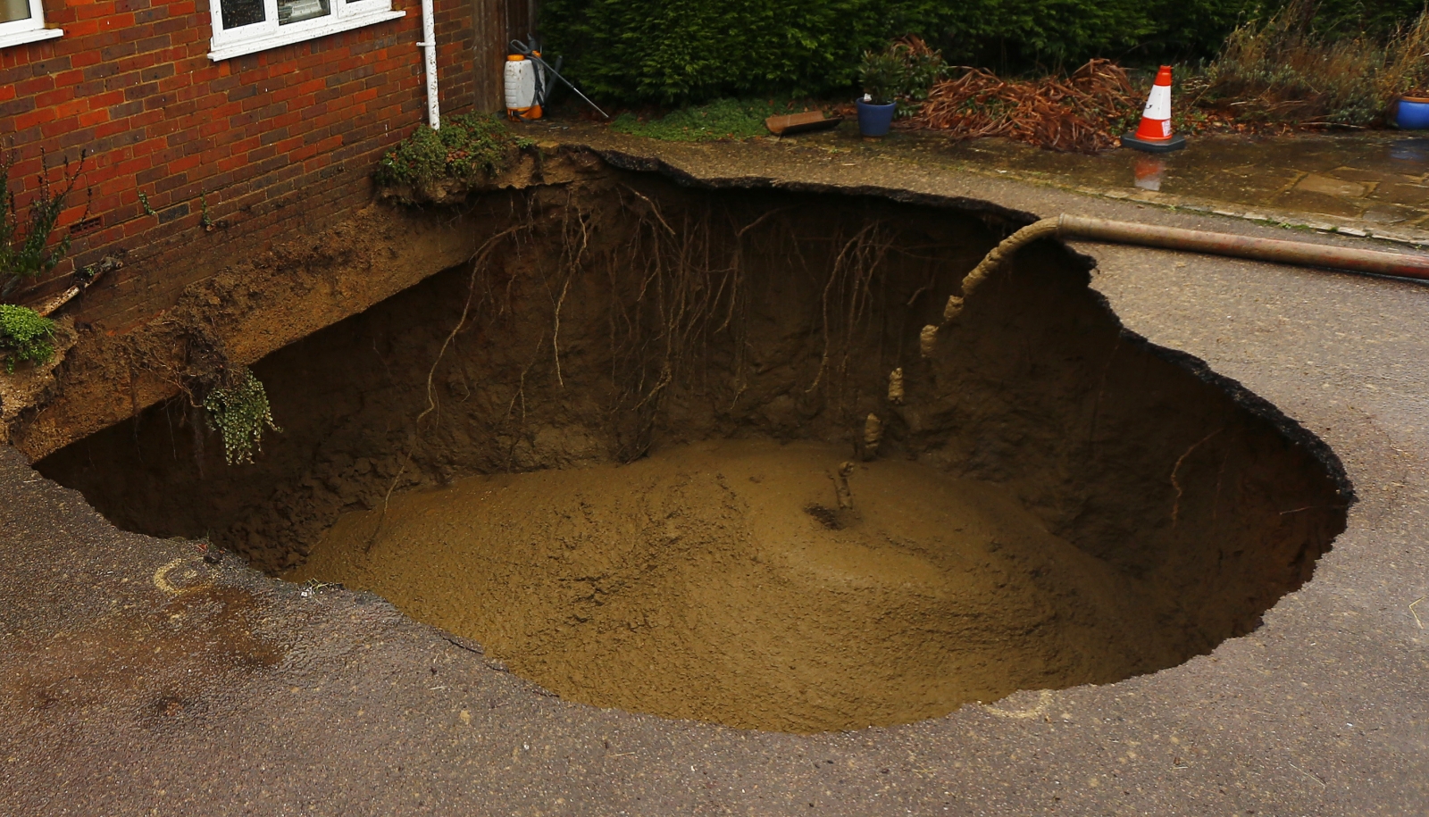 yorkshire-pensioner-avoids-injury-after-30ft-sinkhole-opens-up-in-back