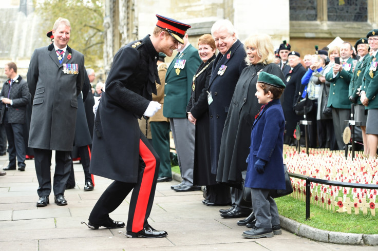 Prince Harry joking with a child