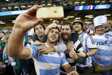 Argentine rugby player poses with fans