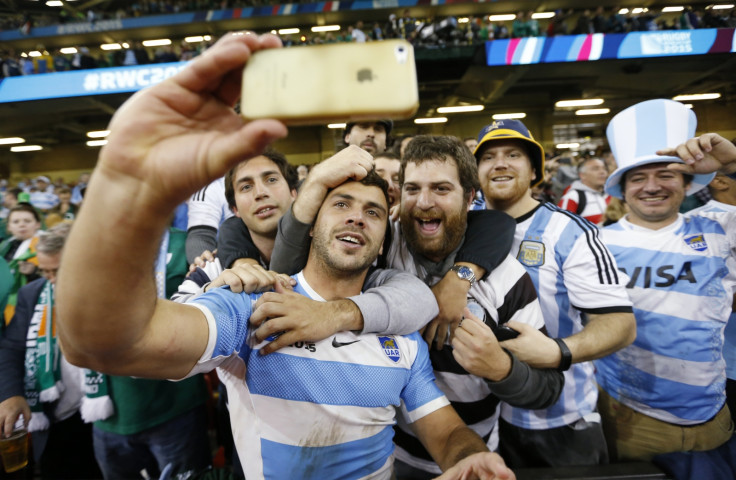 Argentine rugby player poses with fans