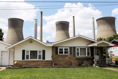 Coal plant seen behind West Virginia home