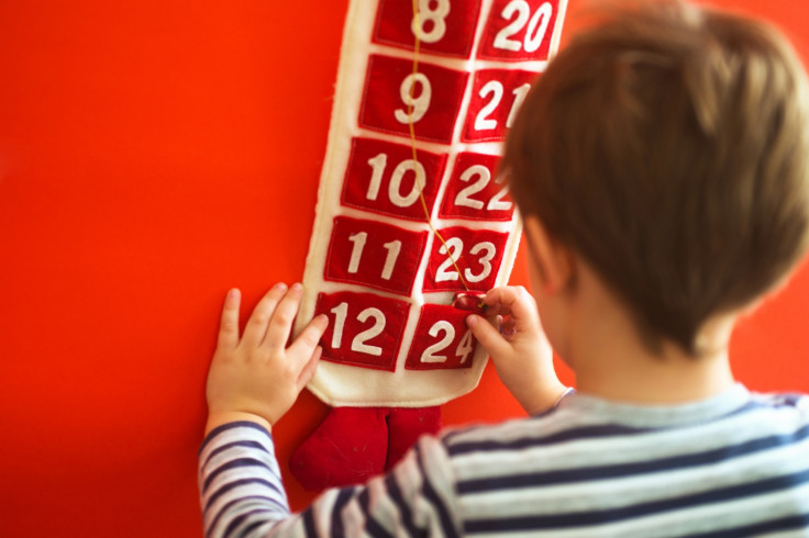 Boy opens Advent calendar