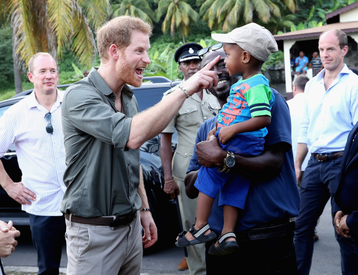 Prince harry meets child in Caribbean