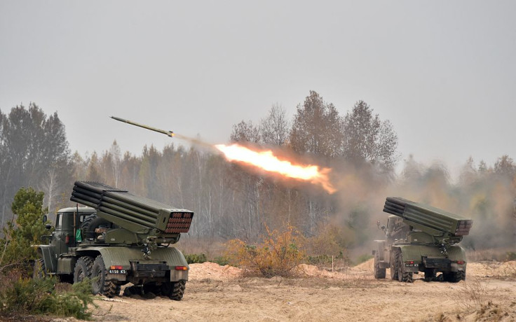 Ukrainian 122 mm MLRS BM-21 Grad fires rocket during a military exercise at a shooting range close to Devichiki in the Kiev region