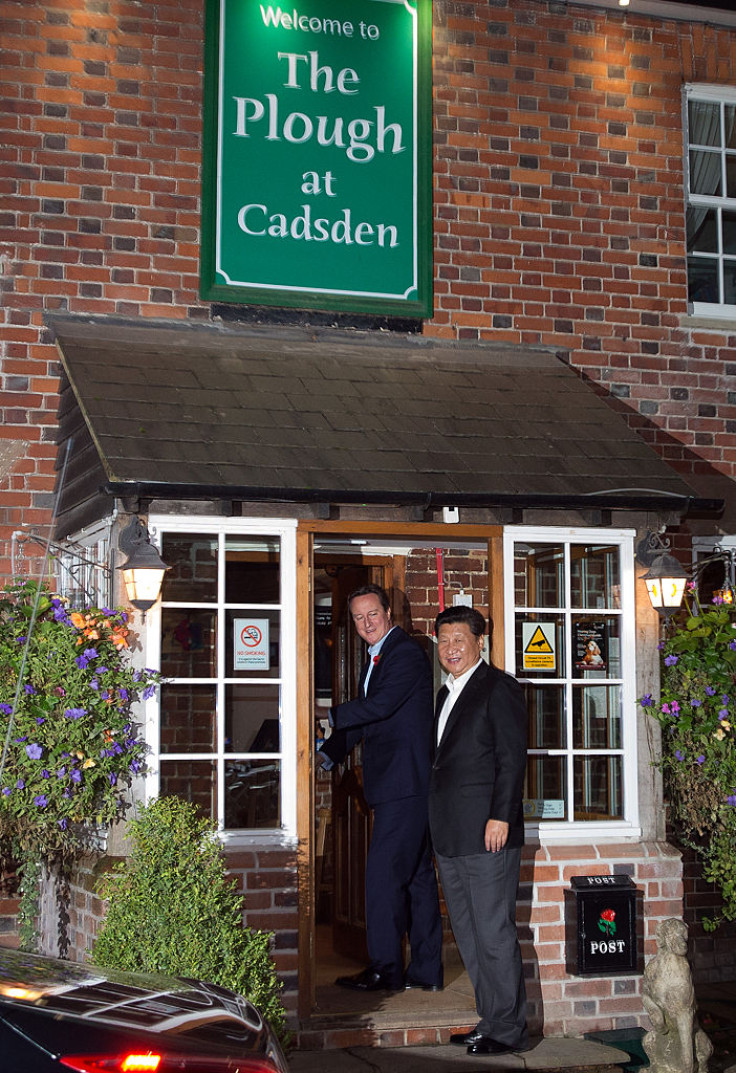 Prime Minister David Cameron arrives at The Plough pub with China's president Xi Jinping on October 22, 2015