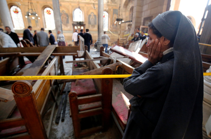 A nun cries as she stands at the scene inside Cairo's Coptic cathedral, following a bombing, in Egypt