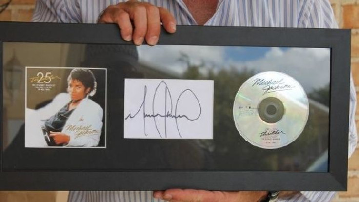 Luke Moore's autographed Michael Jackson items
